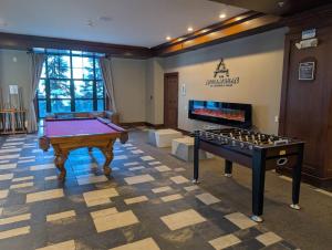 a billiard room with a pool table and avertisement at Mt. Slope Great View 1 Bed Condo in Vernon Township