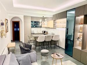 a kitchen and living room with a couch and a table at Varja 3 Apartment in Pržno