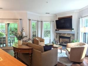 a living room with a couch and a fireplace at Country Chic New 2 Bed 2 Bath in Vernon Township