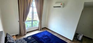 a room with a large window and a blue rug at Master Room with Private Bath at Kajang in Kajang