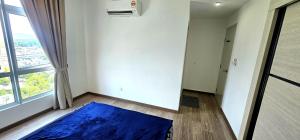 a room with a blue rug on the floor next to a window at Master Room with Private Bath at Kajang in Kajang +5 photos