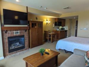a hotel room with a bed and a fireplace at Rustic classic spacious Studio in Vernon Township +4 photos
