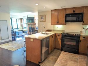 a kitchen with a sink and a stove top oven at Great Views 2 Bed 2 Bath Updated in Vernon Township