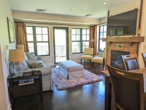 a living room with a couch and a fireplace at Great Views 2 Bed 2 Bath Updated in Vernon Township
