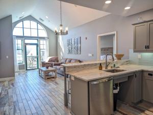 a kitchen and living room with a counter top at 2 Bed Top Flr Prem Penthouse Suite in Vernon Township