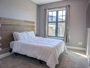 a bedroom with a large bed and a window at 2 Bed Top Flr Prem Penthouse Suite in Vernon Township +34 photos