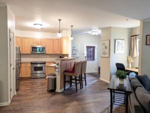 a kitchen and living room with a couch and a table at Spacious 3 bed 2 bath Sanctuary in Vernon Township