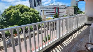 a white railing on a balcony with a view of a city at Casa Agena in Cartagena de Indias