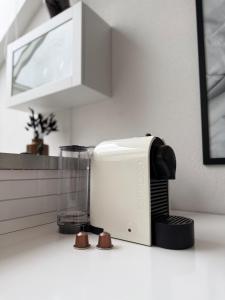 a kitchen counter with a toaster and a blender at Penthouse Studio in Stockholm