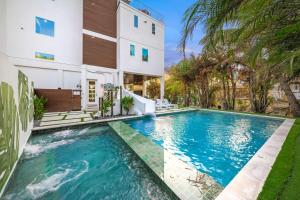 a swimming pool in the backyard of a house at Top Deck Estate in Siesta Key +65 photos