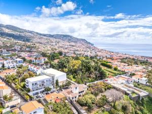 an aerial view of a city with the ocean at Pátio da Achada View Apartment in Funchal