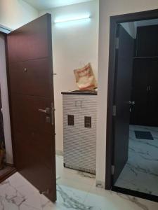 a door leading to a room with a dog house at SUMATHY GIRLS HOSTEl in Chennai