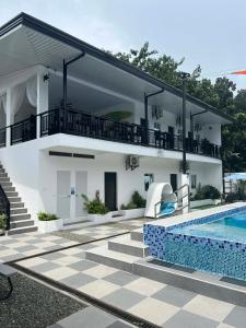 a villa with a swimming pool and a house at Villa Trajano Resort in San Antonio