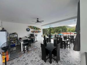 a dining room with a table and chairs at Villa Trajano Resort in San Antonio