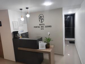 a lobby of a medical dental cell center with a table at Hotel Portal Del Cerro Manizales in Manizales