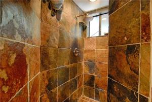a bathroom with a tiled shower with a window at The Gingerbread Cottage in Kings Beach +21 photos