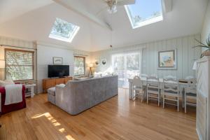 a living room with a couch and a dining room at Sparrow's Rest - Duck, Sanderling, 350 Yards to the Beach, Community Pool, YR Flex Stays in Duck