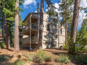 a large house in the woods with trees at Bear's Den in Kings Beach