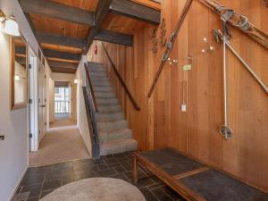 a hallway of a house with stairs and a table at Bear's Den in Kings Beach