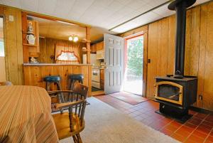 a kitchen with a stove and a table and chairs at McCarthy Place in Tahoe Vista