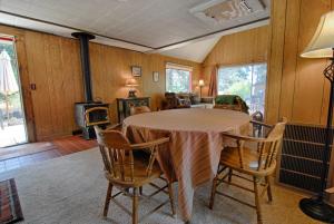 a dining room with a table and chairs and a fireplace at McCarthy Place in Tahoe Vista +13 photos