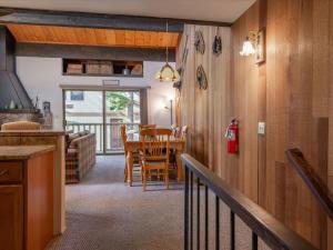 a kitchen and dining room with a table and chairs at Bear's Den in Kings Beach +27 photos