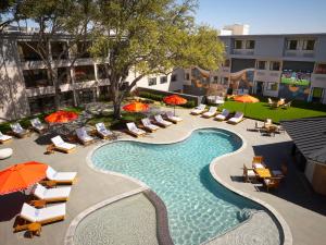 an overhead view of a pool with chairs and umbrellas at Hotel Dax in Addison