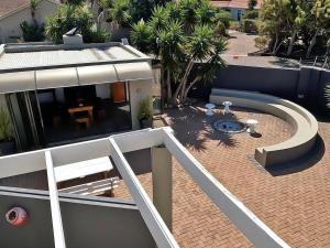 arial view of a balcony of a house at Beachwood Inn Melkbosstrand in Cape Town +8 photos