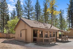 a small building with a porch and a fence at Bearfoot Bungalow in Tahoe Vista