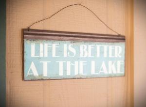 a sign that says life is better at the lake at Bearfoot Bungalow in Tahoe Vista