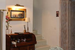 a room with a table with a lamp and stairs at Torre Tresca B&B in Bari