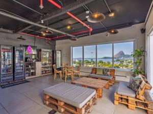 a room with tables and chairs and a table at B&B HOTEL Santos Dumont in Rio de Janeiro