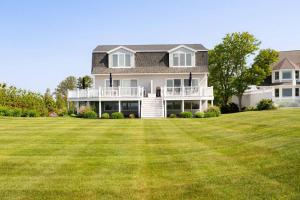 a large house with a large lawn in front of it at Great Hill in Kennebunk