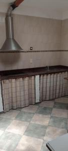 a kitchen with a counter in a room at El Legado in San Pedro