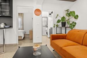 a living room with a couch and a table at Stillar Apartment near sea in Pula