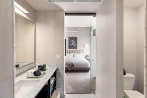 a hotel room with a bed and a bathroom at Stanton House El Paso in El Paso +101 photos