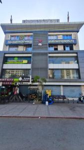 a large building with a bench in front of it at The Bull Group International in Surat