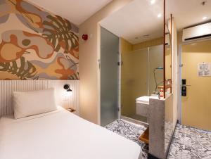 a hotel room with a bed and a shower at B&B HOTEL Santos Dumont in Rio de Janeiro +27 photos