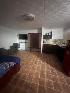 a large living room with a couch and a table at Villa Luis in Boquete