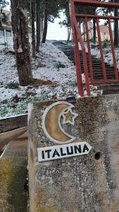 a sign for a train station in the snow at Casa Rural Italuna in Jarque de la Val +248 photos
