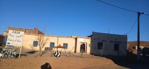 a building in the middle of a desert at ZAZA Guest house in Agoudal