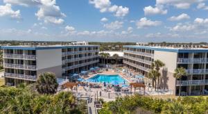 an aerial view of a resort with a swimming pool at The Beach Club St Augustine by Coolvacay in Saint Augustine Beach