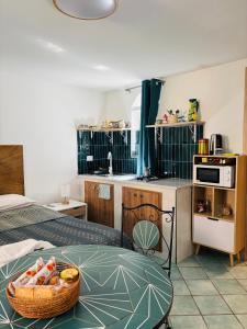a kitchen with a table with a bowl of fruit on it at Lemontree House Bacoli in Bacoli