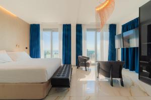 Llit o llits en una habitació de Hotel Villa Levi
