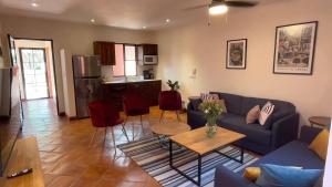 a living room with a couch and a table at Casa Callejon in San Miguel de Allende