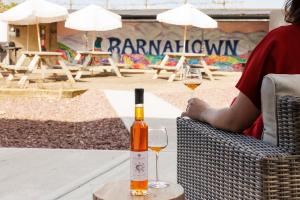 a person sitting at a table with two glasses of wine at Barnahown B&B, Mitchelstown in Mitchelstown
