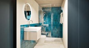 ein Badezimmer mit Waschbecken, Toilette und Spiegel in der Unterkunft Schiffli - Boutique Apartments - Self Check In in Rapperswil-Jona