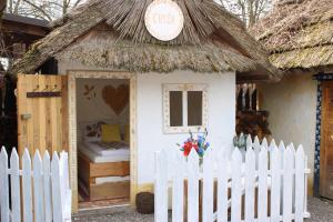 a pretend play house with a thatched roof at Folklórna chyža in Bojnice