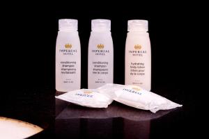 two bottles of virgin milk and two bags at Imperial Hotel Brooklyn New in Brooklyn