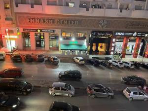 a group of cars parked in a parking lot at Studio in Ariana